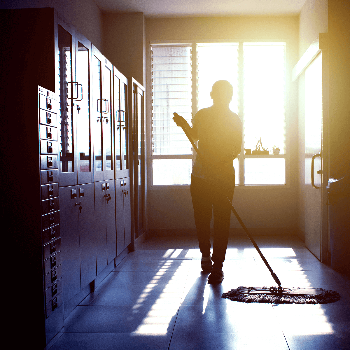 Employee mopping hallway